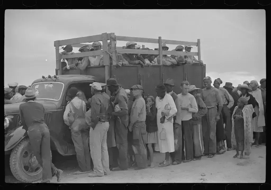 Vegetable workers migrants waiting after work to be paid